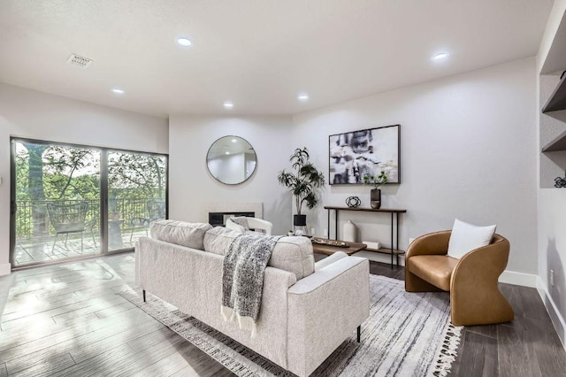 8200 Neely Dr Unit 160, Austin, TX 78759 - living room featuring a fireplace, recessed lighting, and wood finished floors