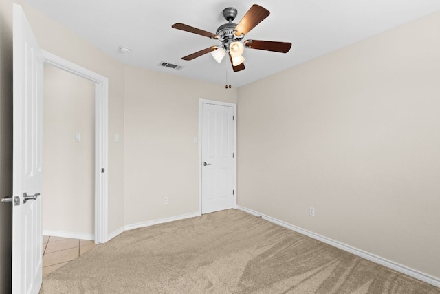 3402 Lauren St, Copperas Cove, TX 76522 - empty room featuring light carpet, ceiling fan, and a smoke detector