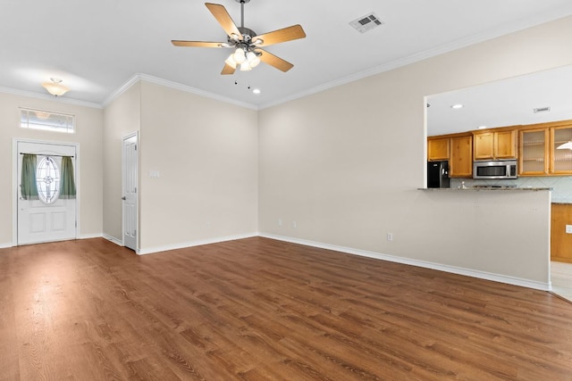 3402 Lauren St, Copperas Cove, TX 76522 - unfurnished living room with wood finished floors, a ceiling fan, crown molding, and recessed lighting