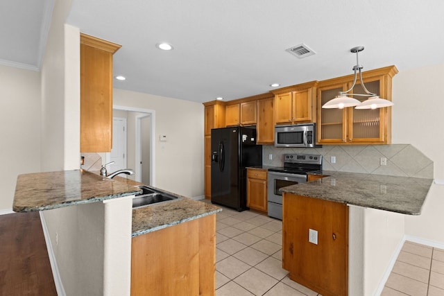 3402 Lauren St, Copperas Cove, TX 76522 - kitchen with stainless steel appliances, a peninsula, light tile patterned floors, glass insert cabinets, and recessed lighting