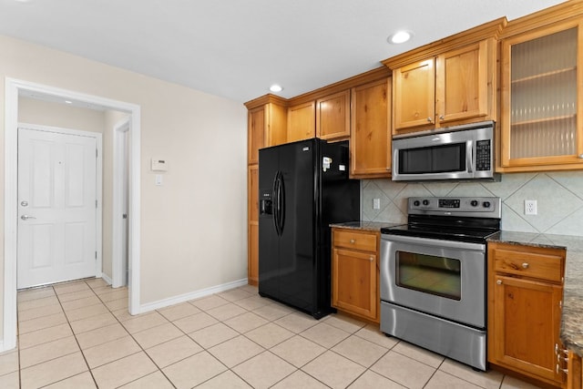 3402 Lauren St, Copperas Cove, TX 76522 - kitchen featuring appliances with stainless steel finishes, brown cabinets, light tile patterned floors, backsplash, and recessed lighting