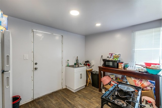 130 Los Arcos Rd, Elgin, TX 78621 - misc room featuring dark wood-type flooring and a sink