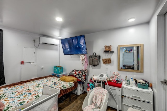 130 Los Arcos Rd, Elgin, TX 78621 - bedroom with a wall mounted air conditioner, wood finished floors, and recessed lighting