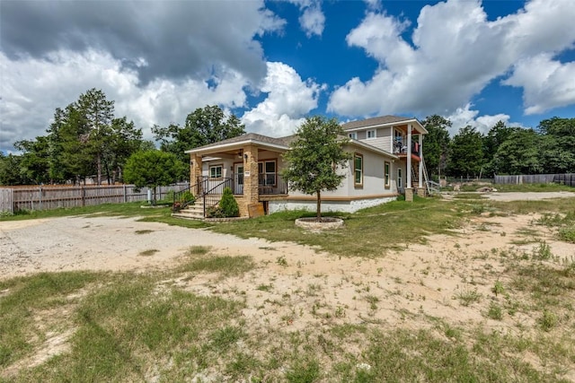 130 Los Arcos Rd, Elgin, TX 78621 - view of front of house with a porch