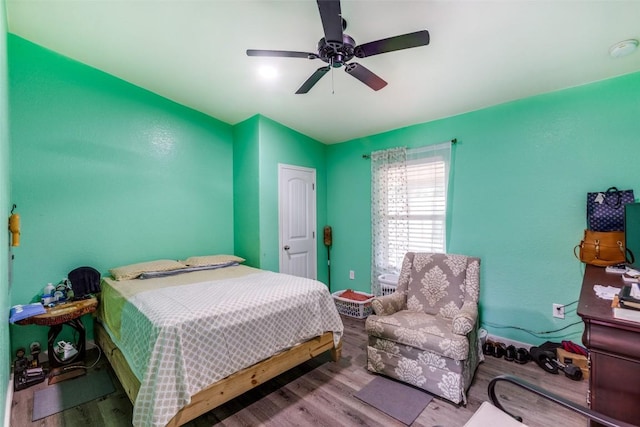 130 Los Arcos Rd, Elgin, TX 78621 - bedroom featuring wood finished floors, vaulted ceiling, and ceiling fan