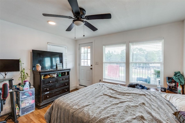 130 Los Arcos Rd, Elgin, TX 78621 - bedroom with wood finished floors and a ceiling fan