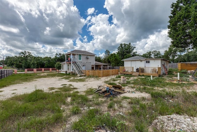 130 Los Arcos Rd, Elgin, TX 78621 - view of yard with a wooden deck and stairway