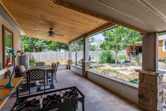 130 Los Arcos Rd, Elgin, TX 78621 - fenced backyard featuring a ceiling fan, a patio area, and outdoor dining space