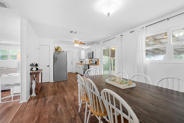 617 Johnson St, Bertram, TX 78605 - dining room featuring dark wood-style floors and ceiling fan