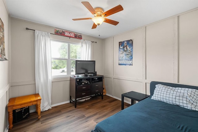 617 Johnson St, Bertram, TX 78605 - bedroom featuring a decorative wall, wood finished floors, and ceiling fan