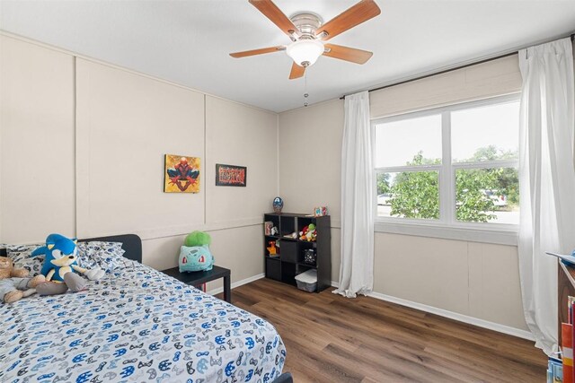617 Johnson St, Bertram, TX 78605 - bedroom featuring wood finished floors and ceiling fan