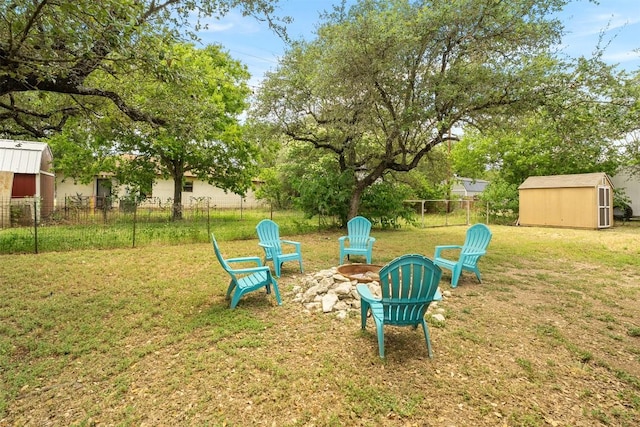 617 Johnson St, Bertram, TX 78605 - view of yard featuring a storage shed and an outdoor fire pit