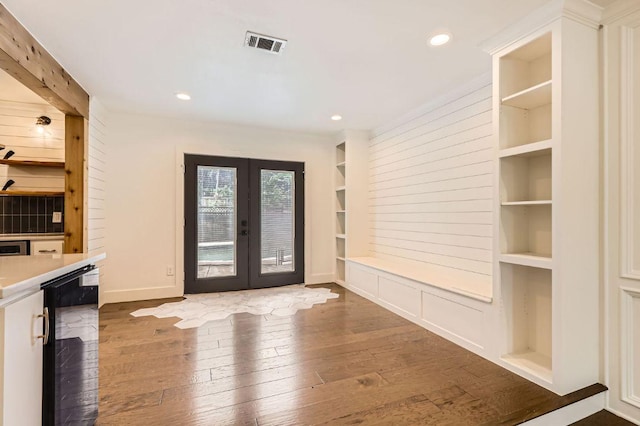 1511 Wilson Heights Dr, Austin, TX 78746 - entryway with french doors, hardwood / wood-style floors, wine cooler, and recessed lighting