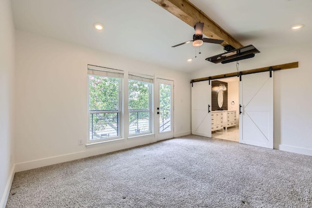 1511 Wilson Heights Dr, Austin, TX 78746 - unfurnished bedroom featuring a barn door, carpet floors, access to exterior, and recessed lighting