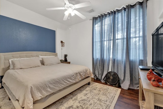 9024 Wildwater Way, Round Rock, TX 78681 - bedroom featuring wood finished floors and a ceiling fan