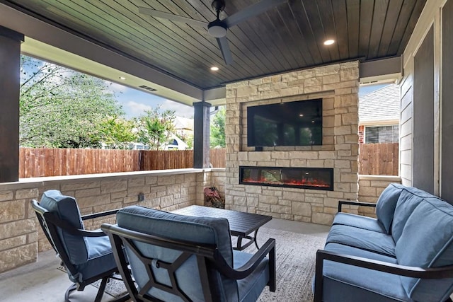 9024 Wildwater Way, Round Rock, TX 78681 - view of patio with ceiling fan and an outdoor living space with a fireplace