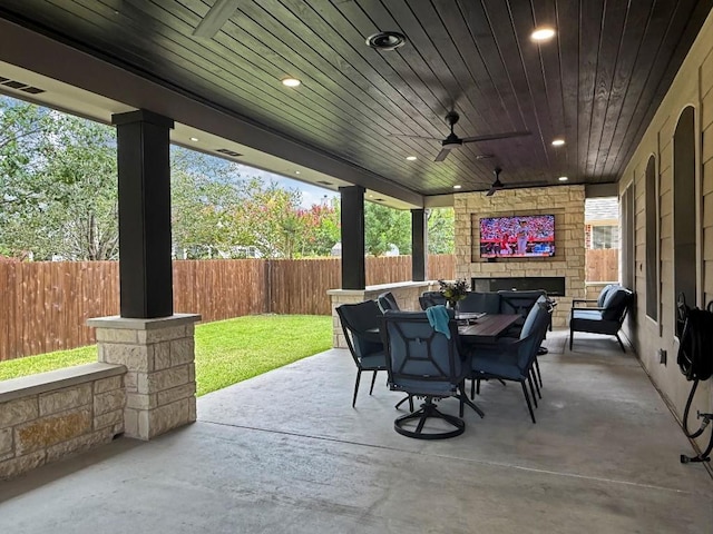 9024 Wildwater Way, Round Rock, TX 78681 - fenced backyard featuring a patio, outdoor dining space, and a ceiling fan