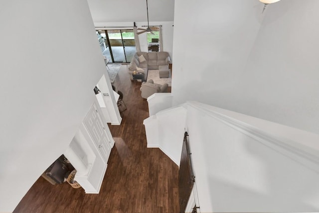 9024 Wildwater Way, Round Rock, TX 78681 - stairs featuring wood finished floors, ceiling fan, and a towering ceiling