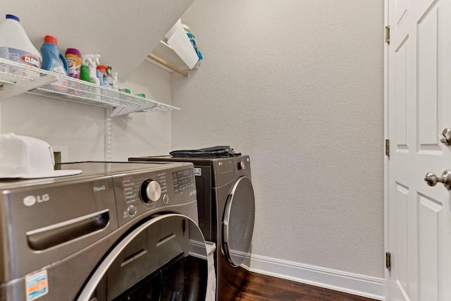 9024 Wildwater Way, Round Rock, TX 78681 - washroom featuring washer and clothes dryer, dark wood finished floors, and a textured wall