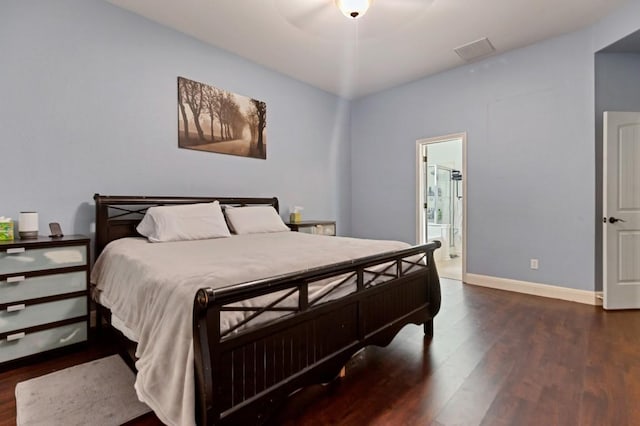 9024 Wildwater Way, Round Rock, TX 78681 - bedroom with wood finished floors and connected bathroom