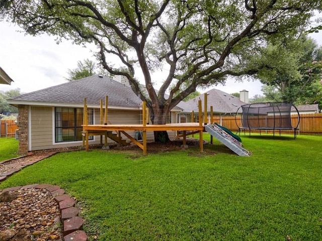 910 Blue Spring Cir, Round Rock, TX 78681 - fenced backyard with a trampoline and a playground