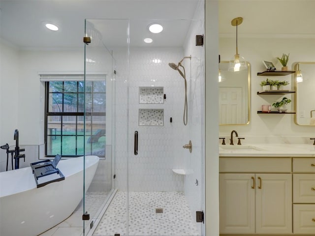 910 Blue Spring Cir, Round Rock, TX 78681 - bathroom featuring a soaking tub, vanity, crown molding, a stall shower, and tile patterned floors