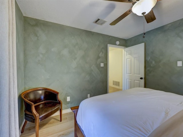 910 Blue Spring Cir, Round Rock, TX 78681 - bedroom with ceiling fan and wood finished floors