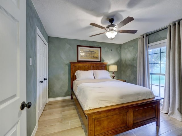 910 Blue Spring Cir, Round Rock, TX 78681 - bedroom featuring light wood-style floors, a closet, and ceiling fan