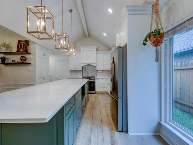 910 Blue Spring Cir, Round Rock, TX 78681 - kitchen featuring freestanding refrigerator, white cabinets, a chandelier, and light countertops
