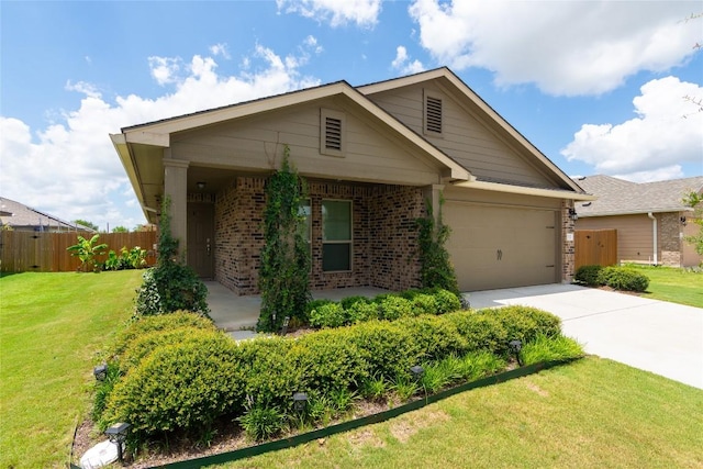 232 Reagor Dr, Taylor, TX 76574 - single story home with brick siding, driveway, and an attached garage