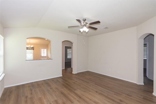 232 Reagor Dr, Taylor, TX 76574 - spare room featuring a ceiling fan, wood finished floors, and arched walkways