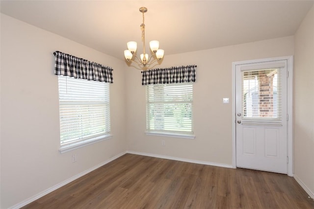 232 Reagor Dr, Taylor, TX 76574 - unfurnished dining area featuring a chandelier, wood finished floors, and plenty of natural light