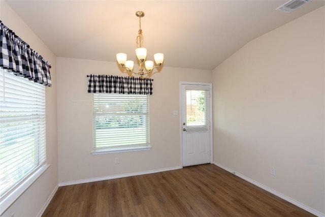 232 Reagor Dr, Taylor, TX 76574 - unfurnished dining area with wood finished floors, a chandelier, and vaulted ceiling