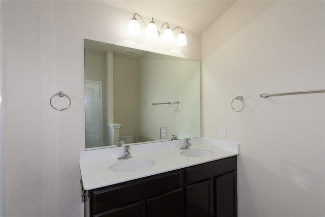 232 Reagor Dr, Taylor, TX 76574 - bathroom featuring double vanity and toilet