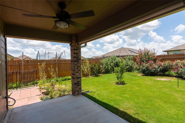 232 Reagor Dr, Taylor, TX 76574 - fenced backyard with a ceiling fan and a patio area