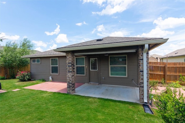232 Reagor Dr, Taylor, TX 76574 - back of property featuring a patio area and roof with shingles