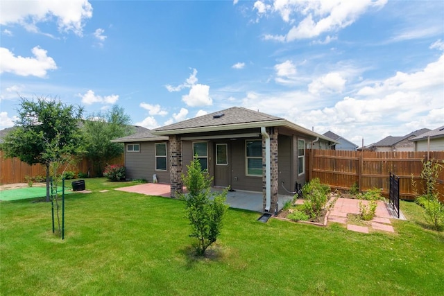 232 Reagor Dr, Taylor, TX 76574 - rear view of property with a patio and a fenced backyard