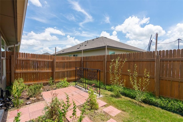 232 Reagor Dr, Taylor, TX 76574 - fenced backyard with a patio area