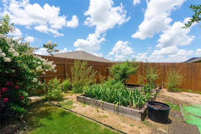 232 Reagor Dr, Taylor, TX 76574 - fenced backyard featuring a vegetable garden