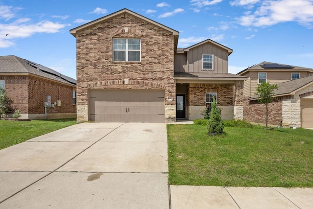 19512 Andrew Jackson St, Manor, TX 78653 - traditional-style house with board and batten siding, a front lawn, driveway, an attached garage, and brick siding