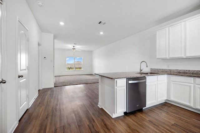 19512 Andrew Jackson St, Manor, TX 78653 - kitchen with stainless steel dishwasher, dark wood-type flooring, white cabinets, stone countertops, and open floor plan