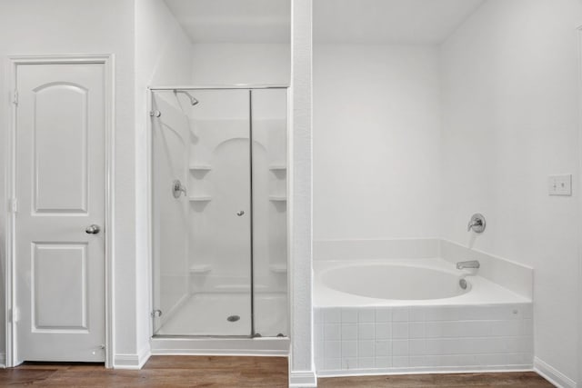 19512 Andrew Jackson St, Manor, TX 78653 - bathroom with wood finished floors, a shower stall, and a garden tub