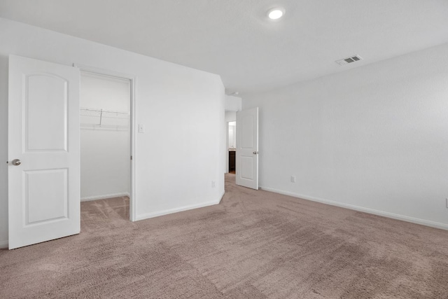 19512 Andrew Jackson St, Manor, TX 78653 - unfurnished bedroom featuring carpet floors, a spacious closet, and a closet