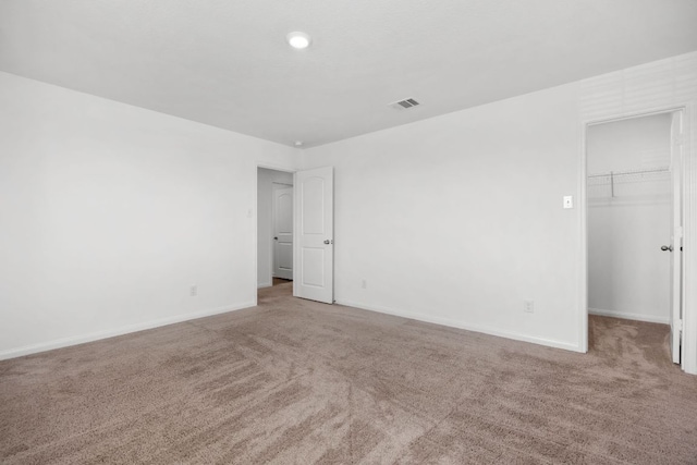 19512 Andrew Jackson St, Manor, TX 78653 - unfurnished bedroom with carpet flooring, a walk in closet, and a closet
