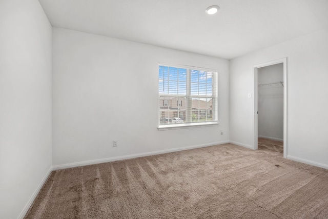 19512 Andrew Jackson St, Manor, TX 78653 - unfurnished bedroom with carpet floors, a walk in closet, and a closet