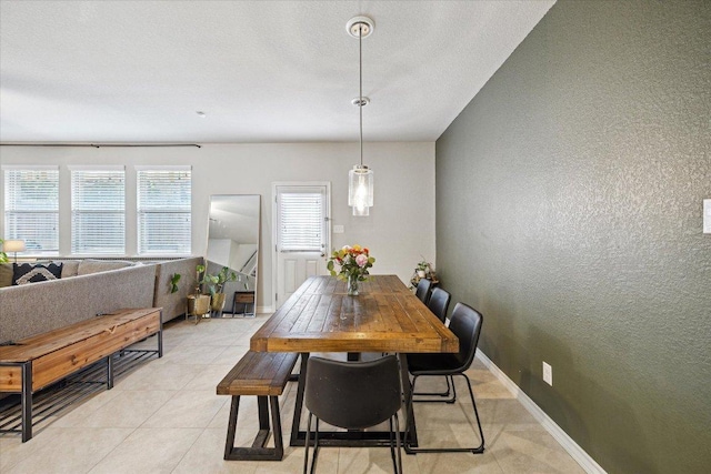 604 John Muir Trl, Leander, TX 78641 - dining room featuring light tile patterned floors and a textured wall