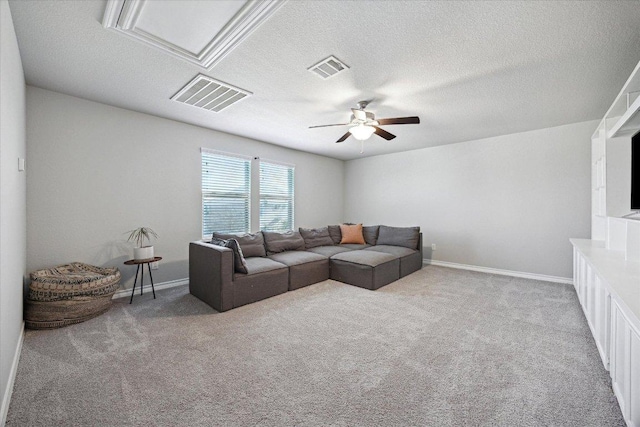 604 John Muir Trl, Leander, TX 78641 - carpeted living area with ceiling fan and a textured ceiling
