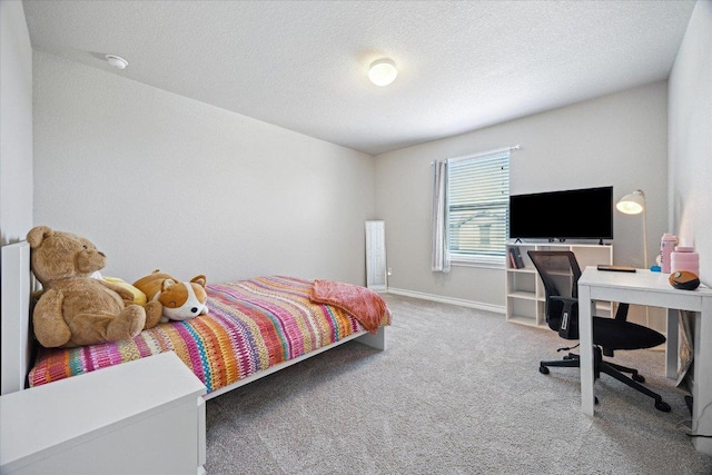 604 John Muir Trl, Leander, TX 78641 - bedroom with carpet floors, a textured ceiling, and a desk