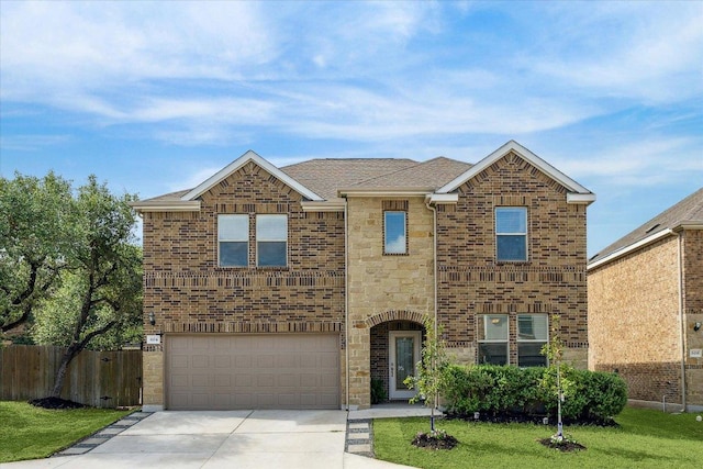604 John Muir Trl, Leander, TX 78641 - traditional home with driveway, stone siding, a garage, and brick siding