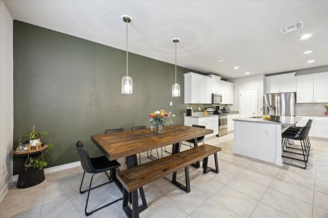 604 John Muir Trl, Leander, TX 78641 - dining space with recessed lighting and light tile patterned flooring